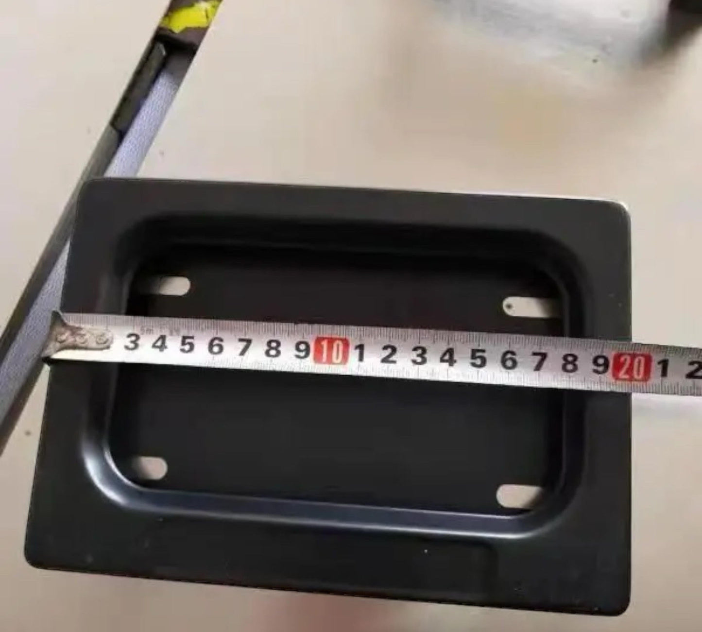 showing the measurements on the Motorcycle license plate hider