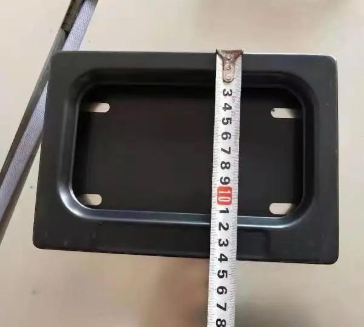 showing the measurements on the Motorcycle license plate hider with remote / blackout plates