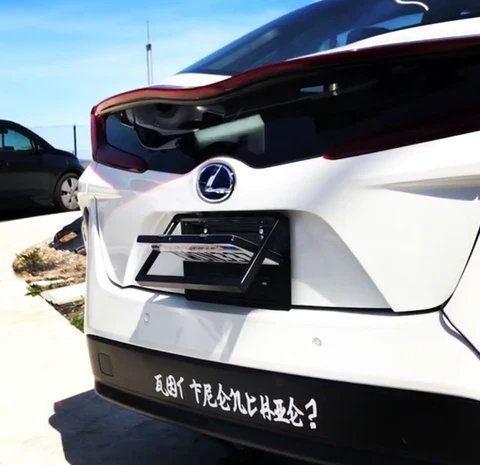 Stealth License Plate Flipper in action on a Toyota Prius showing it fits well on most cars